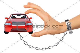 Red car in chained womens hand