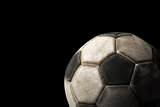 Old Soccer Ball on Black Background