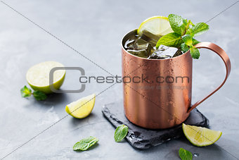 Cold Moscow Mules cocktail ginger beer vodka, lime