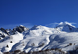 Mount Tetnuldi and off-piste slope with track from ski and snowb