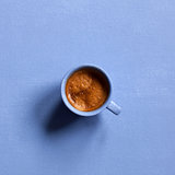 Aroma espresso cup on blue table