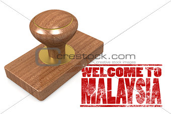 Red rubber stamp with welcome to Malaysia