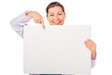Smiling doctor pointing to empty blank poster