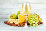 Wineglass white wine with fruits nut
