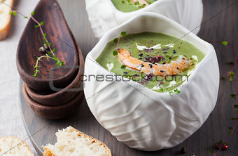 Broccoli, spinach cream soup, shrimp, wooden board