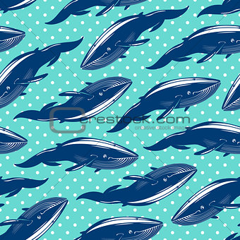 Seamless pattern with whales on blue dotted background