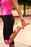 Woman Sports Stretching Using Fitwatch Steps Counter