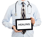 Doctor holding tablet - Healing