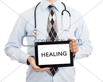 Doctor holding tablet - Healing
