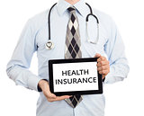 Doctor holding tablet - Health insurance