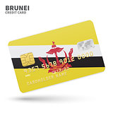 Credit card with Brunei flag background for bank, presentations and business. Isolated on white