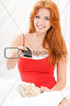 Girl watching movie with popcorn