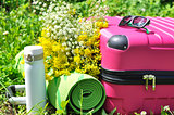Suitcase with thermos and yoga mat