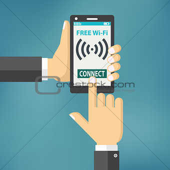 Hand holding smartphone with wifi.