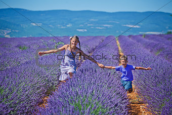 Kids in lavender summer field