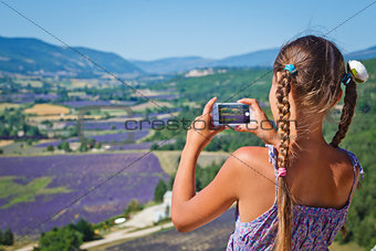 Girl taking photo lavender field