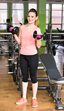 Woman exercising with dumbbells
