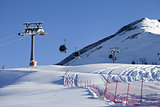 Gondola lift on ski resort at sun day