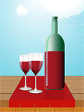 Wine bottle and glasses on wooden table