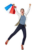 Happy woman with shopping bags on white background rejoicing