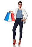 Portrait of smiling woman with French flag colours shopping bags