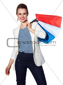 Portrait of happy woman with French flag colours shopping bags