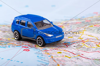 road trip, small toy car on map