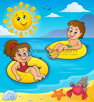 Children in swim rings image 2