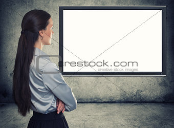 rear view of woman looking at blank screen