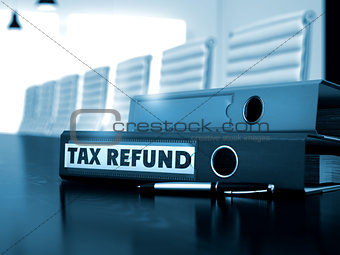 Tax Refund on Office Binder. Blurred Image.