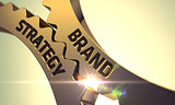 Brand Strategy on Golden Metallic Cog Gears.