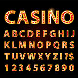 Vector orange neon lamp letters font show casino or theather