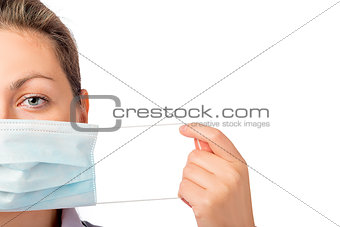 female face close-up and medical mask isolated