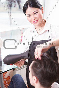 Handsome man in hairdressing saloon