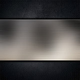 Brushed metal plate on dark grunge background