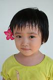 Girl with flower on the ear