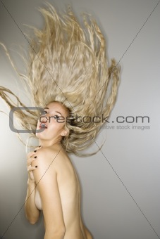Sexy woman with blowing hair.