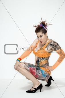 Tattooed woman squatting
