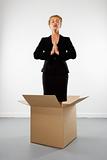 Woman meditating in box.