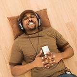 Man relaxing to music.