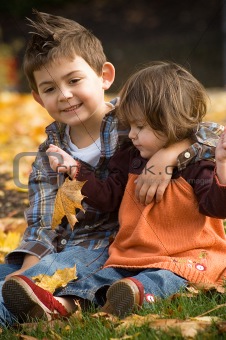Brother and Sister Playing in the fall