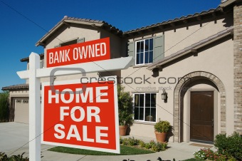 Bank Owned Home For Sale Sign in Front of New House