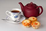 Cup of tea, teapot and cake