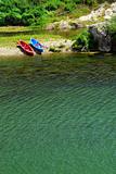 Kayaks on river bank