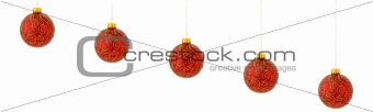 Multiple red hanging Christmas ornaments
