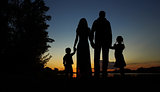 silhouette of a family with children
