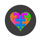 Colorful heart made of puzzle pieces