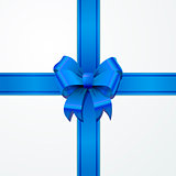 Bright blue bow-knot with tape on white