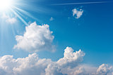 Blue Sky with Clouds and Sun Rays