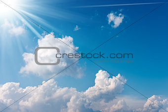 Blue Sky with Clouds and Sun Rays